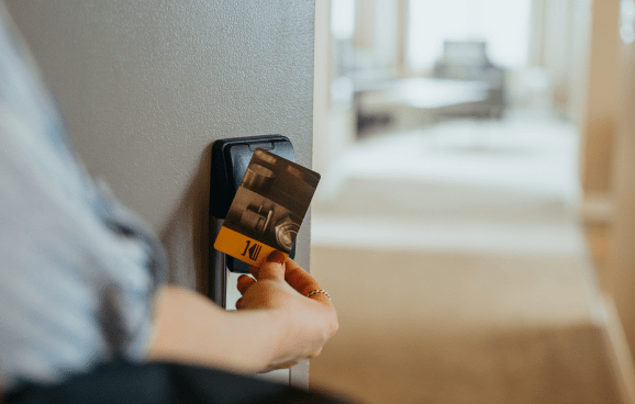 Guest entering suite at One King West Hotel & Residence