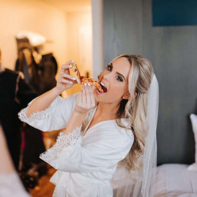 Bride eating pizza